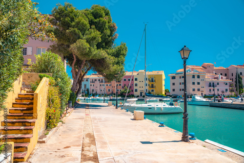 Bright sunny day at Port Saplaya, Valencia's Little Venice. Spain . Yachts docked near  beautiful colorful houses.