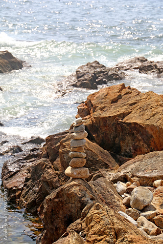Photography Pyramid of pebbles on the ocean