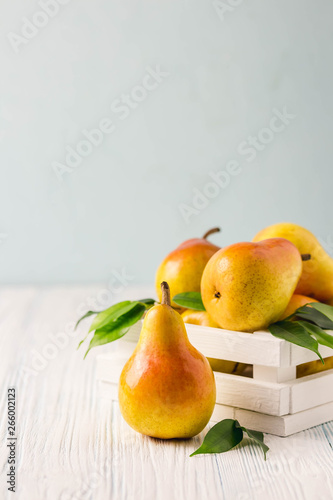 Pears in wooden box.Selective focus, space for text.
