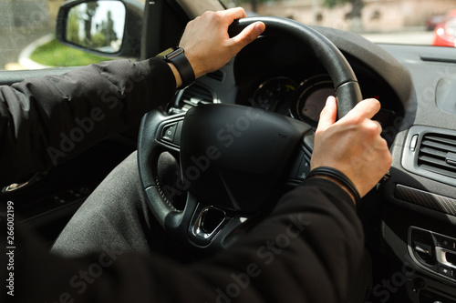 Man driving a car with his hands on the steering wheel © Андрій Орлецький