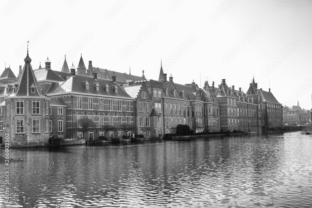 View of the Hofvijver / Court Pond adjoined by museum Mauritshuis and the Binnenhof (Inner court) housing the States General and the Prime Minister of The Netherlands in The Hague, The Netherlands. 