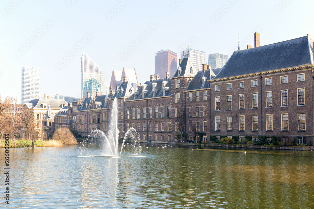 View of the Hofvijver / Court Pond adjoined by museum Mauritshuis and the Binnenhof (Inner court) housing the States General and the Prime Minister of The Netherlands in The Hague, The Netherlands. 