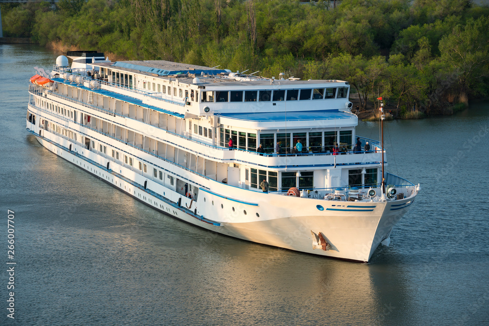 Cruise liner with tourists passes through the Volga-Don Shipping Canal named after Lenin. Volgograd. Russia Cruise liner with tourists passes through the Volga-Don Shipping Canal named after Lenin. Volgograd. Russia