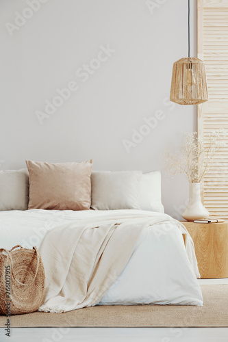 Valokuva White and bright bedroom interior with natural accents