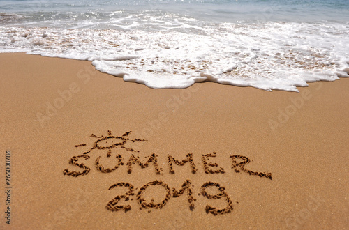 Summer 2019 sign on the sand beach