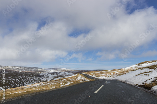 Dramatic winding road and rolling hills - Landscape scenery from Buttertubs Pass, Yorkshire Dales photo