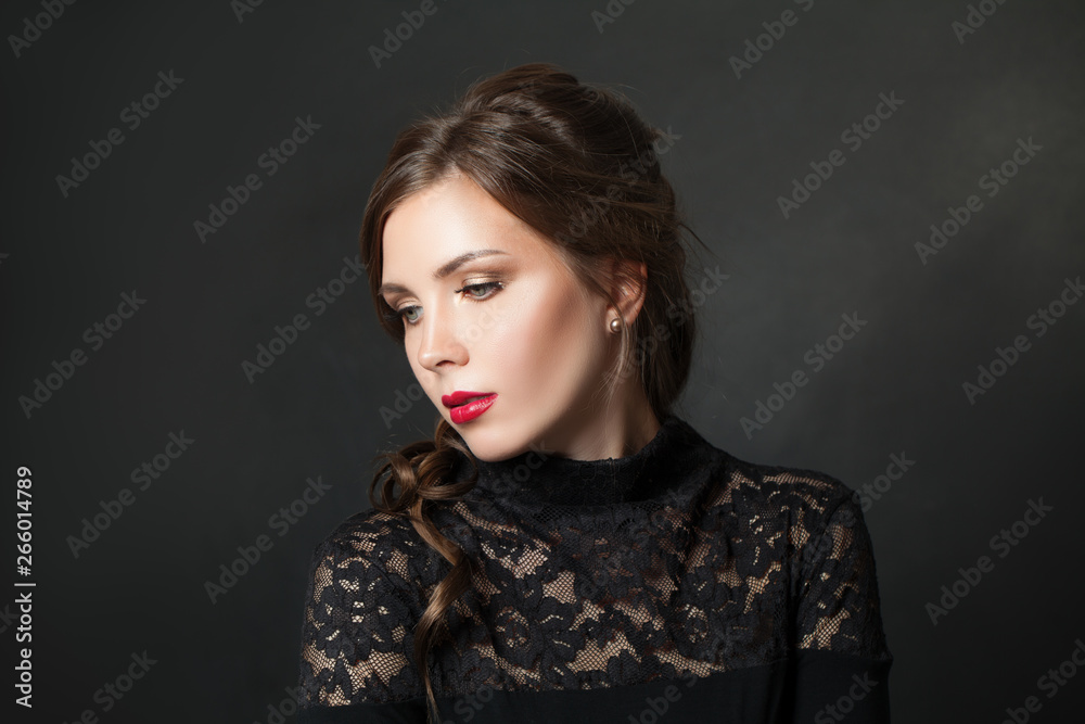 Young beautiful woman with red lips makeup hair on black background Young beautiful woman with red lips makeup hair on black background