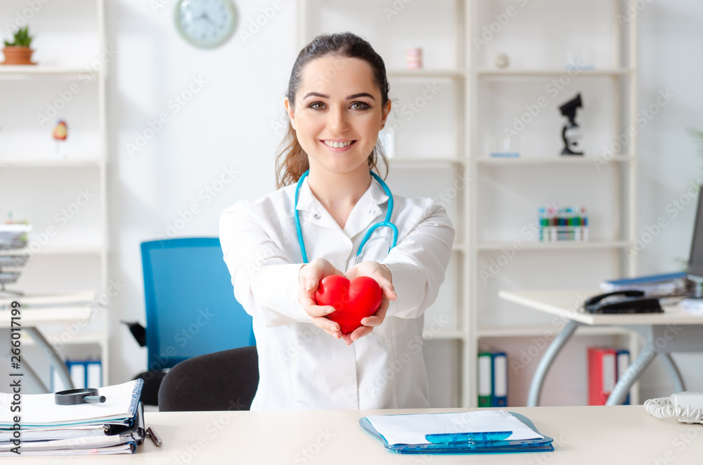 Young female doctor cardiologist working in the clinic Young female doctor cardiologist working in the clinic