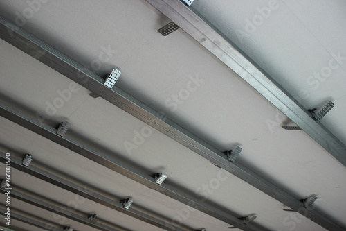 Metal profile base for suspended ceiling - texture for background, apartment renovation