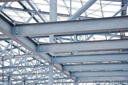 Metal frame of the new building against the sky