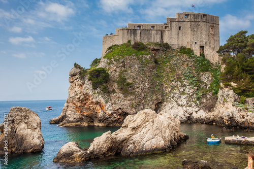 Dubrovnik West Pier and the medieval Fort Lovrijenac located on the western wall of the city