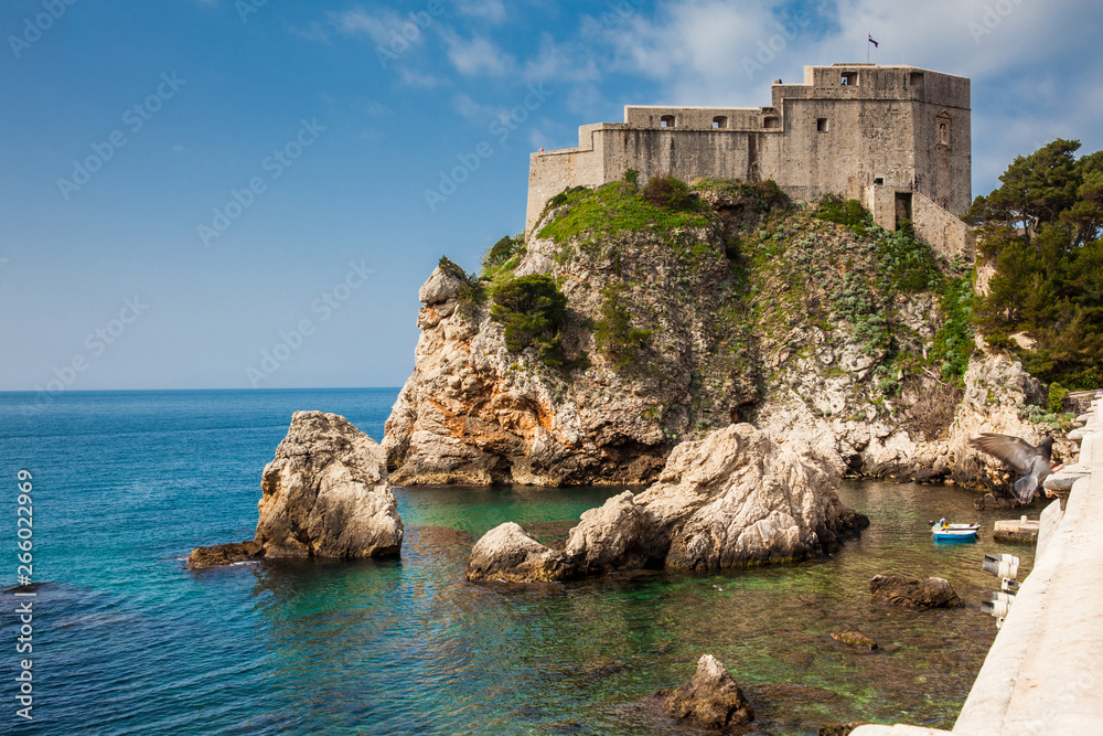 Dubrovnik West Pier and the medieval Fort Lovrijenac located on the western wall of the city Dubrovnik West Pier and the medieval Fort Lovrijenac located on the western wall of the city