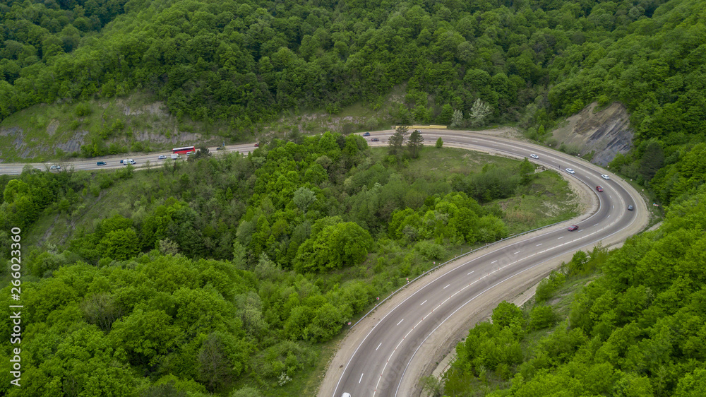 Serpentine Road Among Green Hills of Peak Caucasian Mountains, Russia