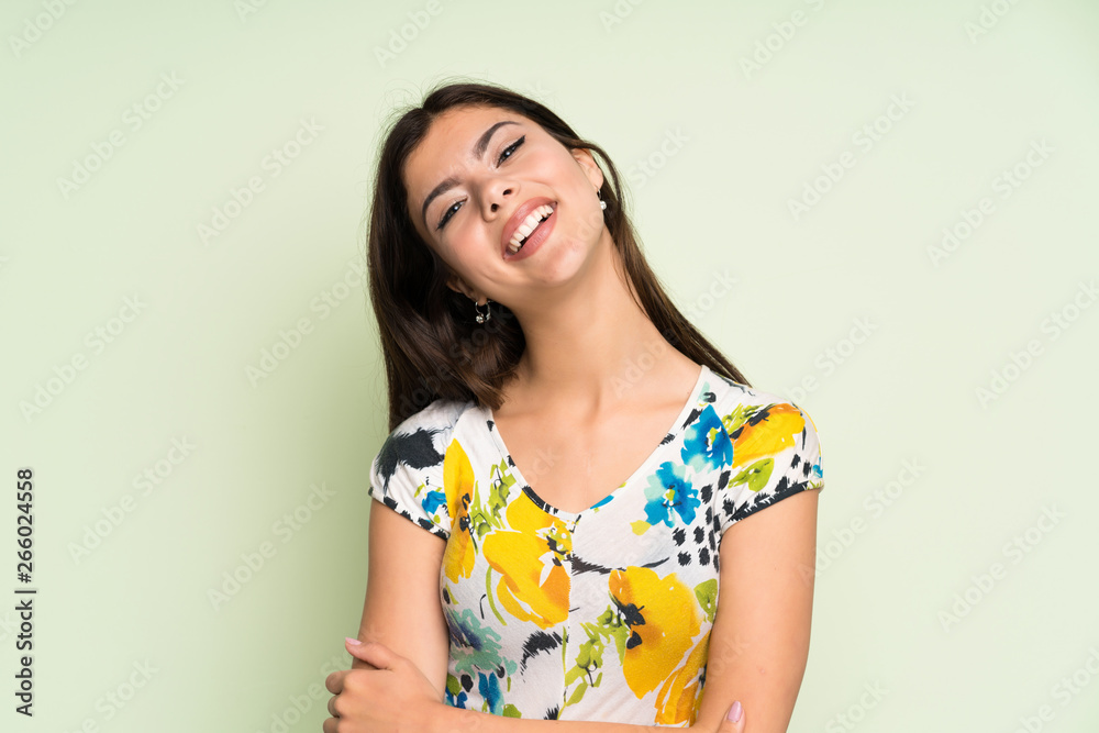 Teenager girl with floral dress laughing Teenager girl with floral dress laughing