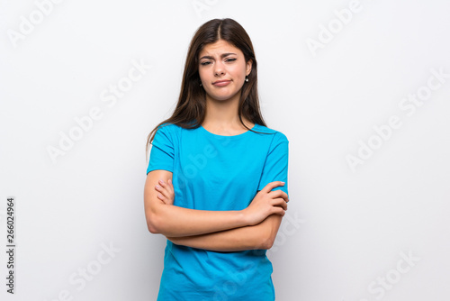 Teenager girl with blue shirt feeling upset