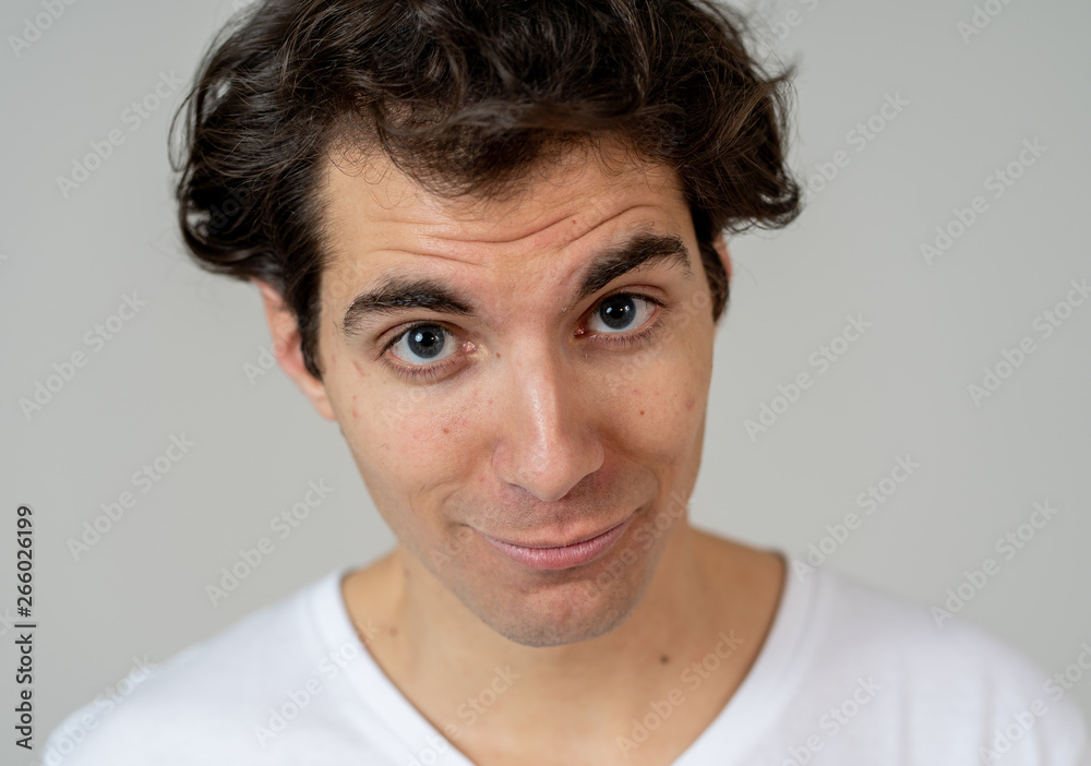 Funny face. Portrait of young man making amusing gestures Funny face. Portrait of young man making amusing gestures