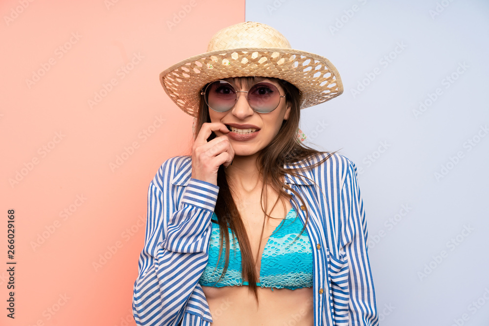 Young woman in bikini nervous and scared Young woman in bikini nervous and scared