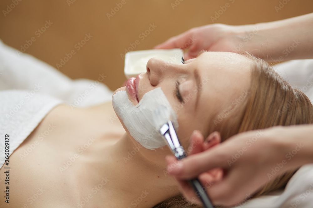 Fototapeta premium cosmetology and treatment concept - close up of beautiful young