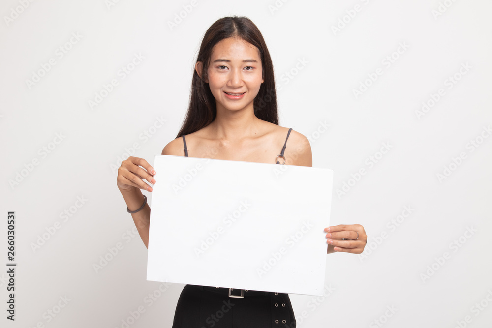 Young Asian woman with white blank sign. Young Asian woman with white blank sign.