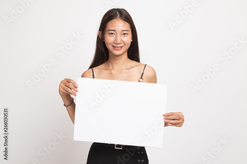 Young Asian woman with white blank sign. © halfbottle