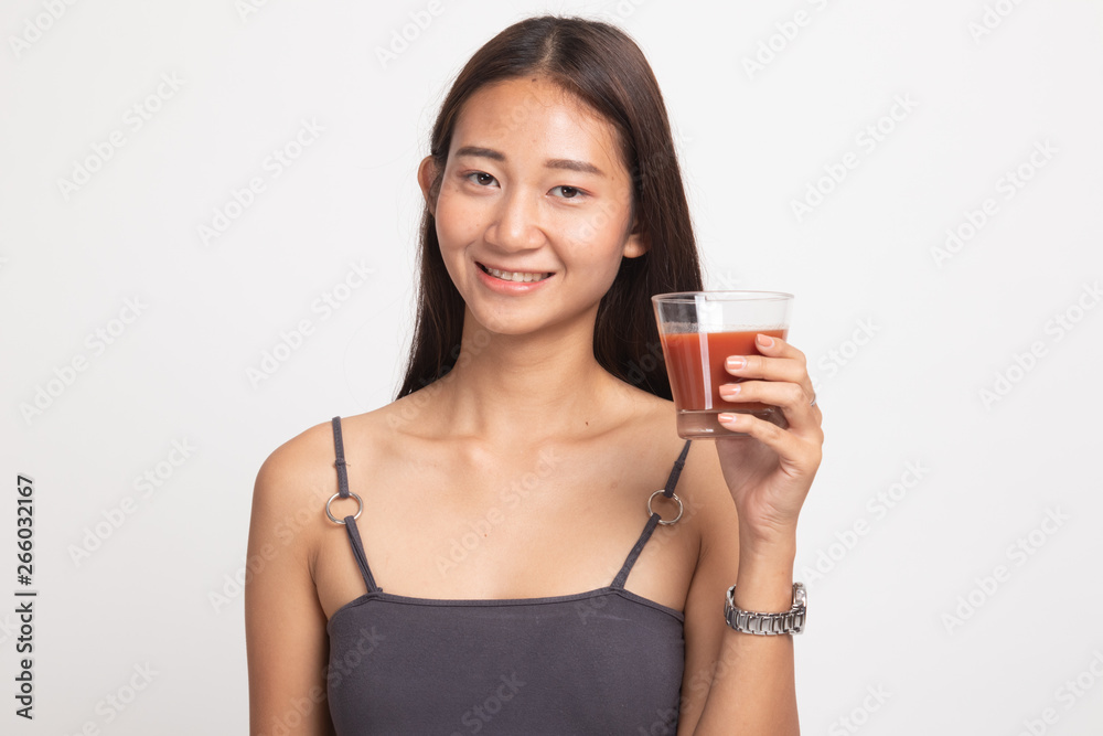 Young Asian woman drink tomato juice. Young Asian woman drink tomato juice.