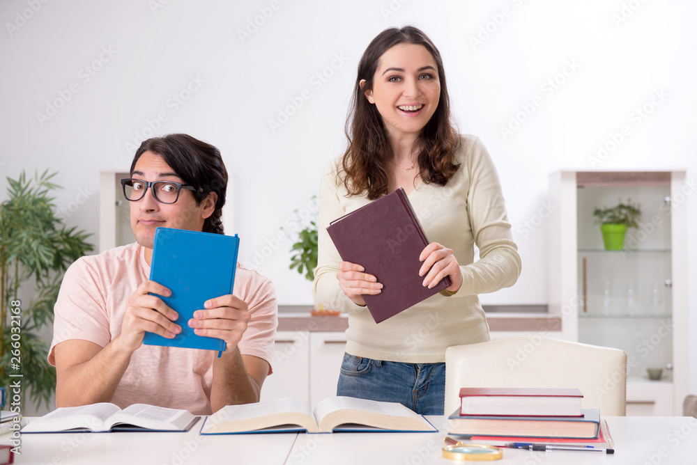 Students preparing for exam together at home Students preparing for exam together at home