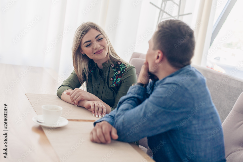 boyfriend and girlfriend enjoy each other indoor. Together forever. Loving Couple on the date in cafe. Happy couple drinking coffee.love story concept boyfriend and girlfriend enjoy each other indoor. Together forever. Loving Couple on the date in cafe. Happy couple drinking coffee.love story concept