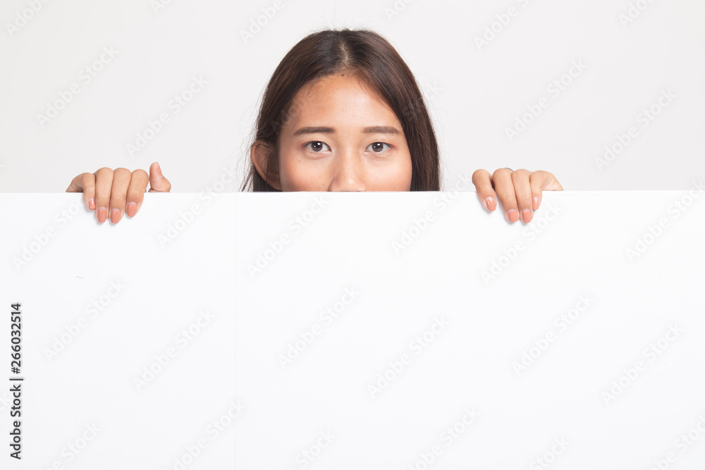Close up of young Asian woman behind a blank sign. Close up of young Asian woman behind a blank sign.