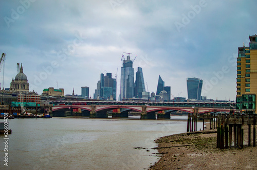 Bridge on river thames and tall buildings