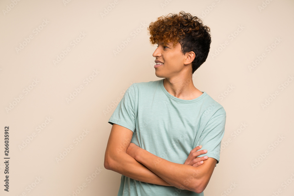 African american man with green shirt happy and smiling African american man with green shirt happy and smiling