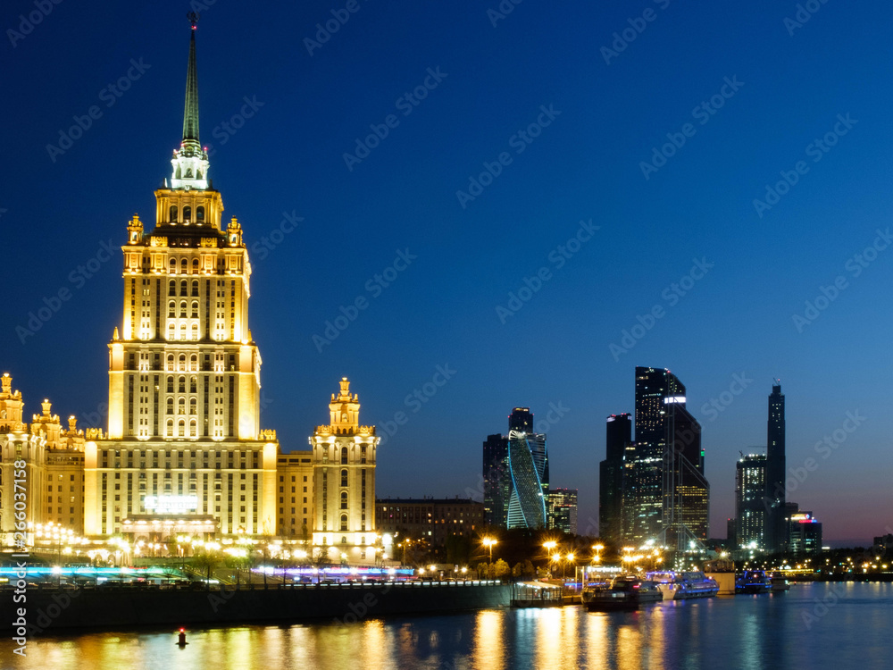 Moscow, Russia - 30 April 2019. Illuminated facade of The Hotel Ukraina, Radisson Collection hotel, one of seven stalinism skyscrapers also known as Seven Sisters