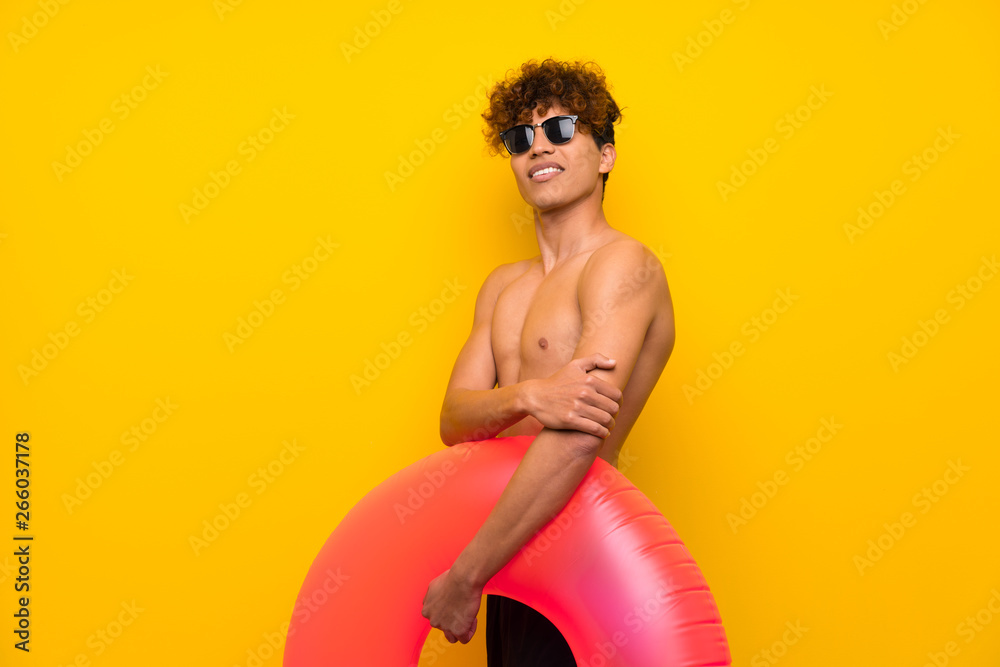 African american man over isolated purple wall standing and looking to the side African american man over isolated purple wall standing and looking to the side
