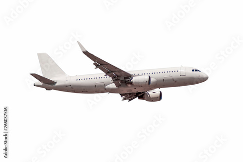 White passenger commercial plane side view in flight isolated on white. The aircraft flies airplane a background of clouds. - Image