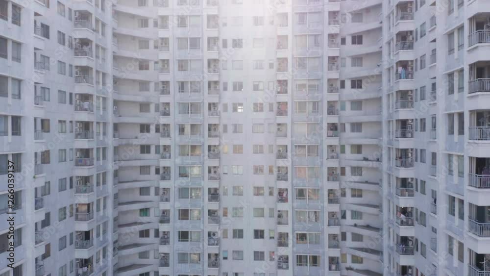 Aerial view of modern apartment building exterior on the morning in the city. Shot in 4k resolution from a drone flying down Aerial view of modern apartment building exterior on the morning in the city. Shot in 4k resolution from a drone flying down