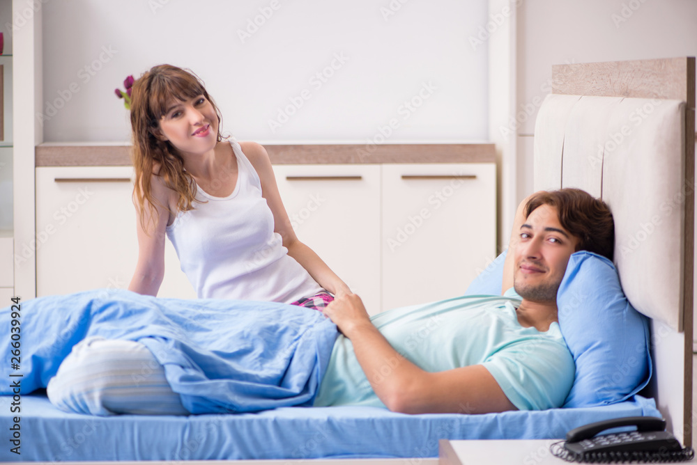 Young couple in the bedroom Young couple in the bedroom