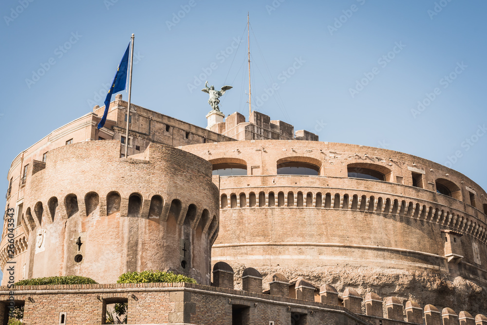 Historic castle of Rome on a blue sky with the European flag