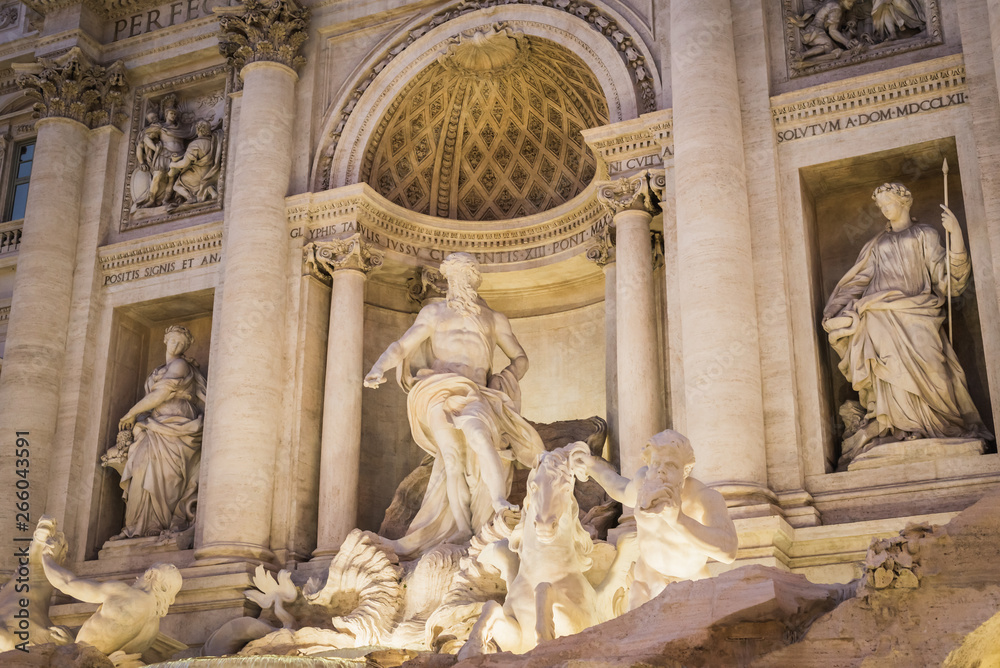 Statues of the Trevi Fountain at night in Rome