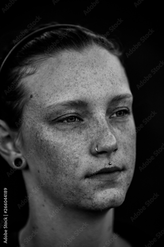 Young attractive red head girl with freckles enjoying relaxation out in the nature Young attractive red head girl with freckles enjoying relaxation out in the nature