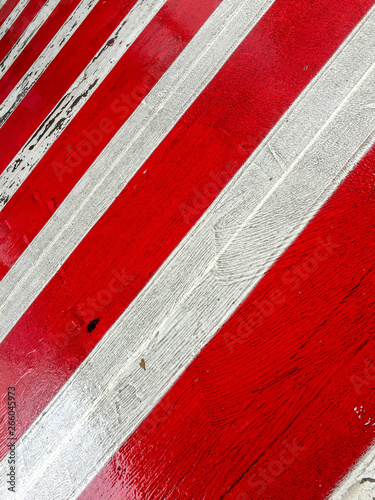 Red and white painted zebra crossing