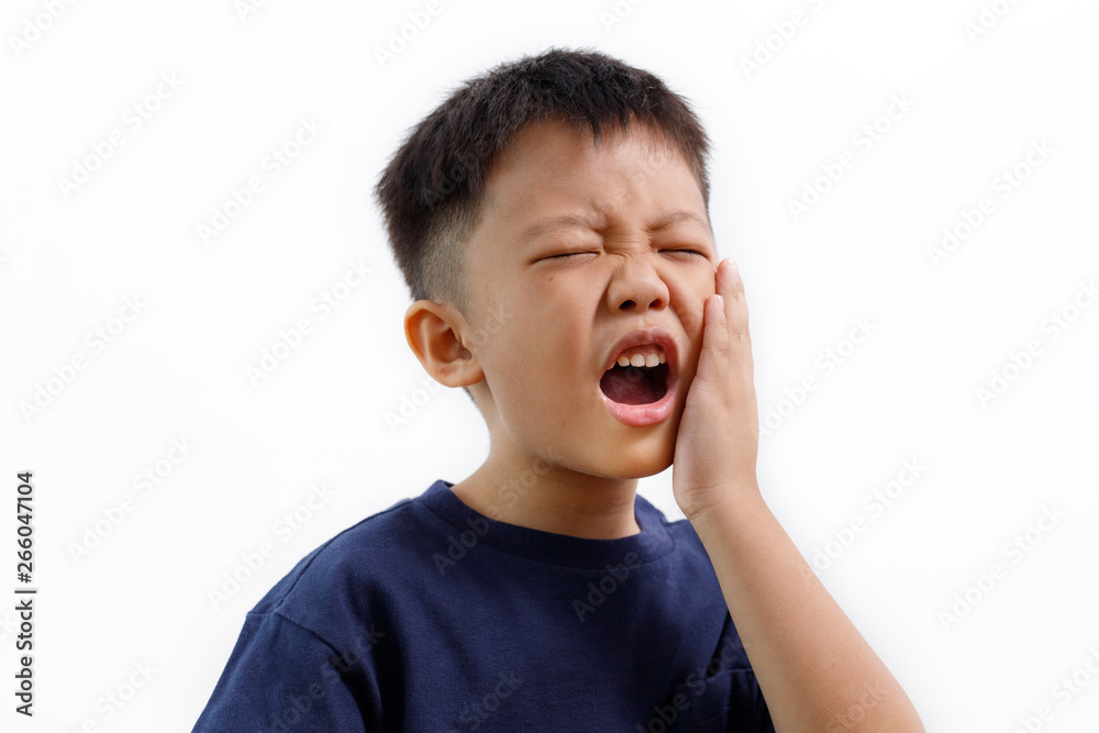 Asian kid suffering from toothache pain, holding his cheek, isolated on white background. Dental Health And Care Concept. - obrazy, fototapety, plakaty 