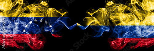 Venezuela vs Colombia  Colombian smoky mystic flags placed side by side. Thick colored silky smoke flags of Venezuela and Colombia  Colombian