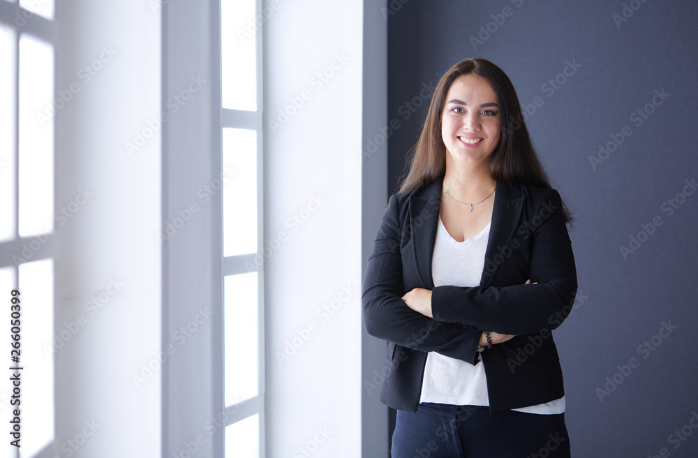 Modern business woman standing in the office . Modern business woman standing in the office .