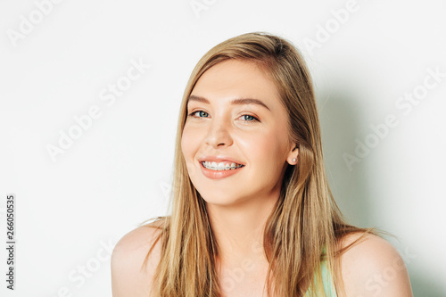 Close up portrait of beautiful young woman with blond hair and nude make up