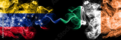 Venezuela vs Ireland, Irish smoky mystic flags placed side by side. Thick colored silky smoke flags of Venezuela and Ireland, Irish photo