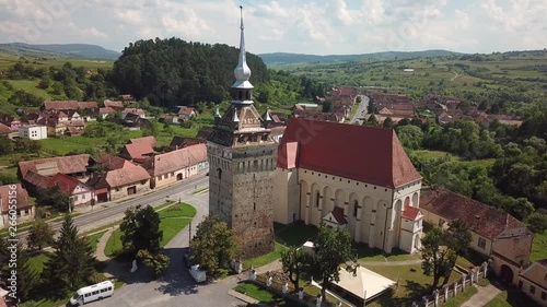 Saschiz Szaszkezd old medieval Saxon village with fortified church bell tower and castle ruin near Sighisoara Romania Transylvania photo