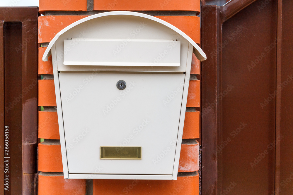 A beautiful mailbox hangs waiting for newspapers, parcels and letters. A beautiful mailbox hangs waiting for newspapers, parcels and letters.
