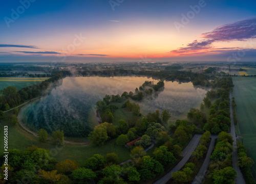 Early morning sunrise as an aerial with a lake as main motive.