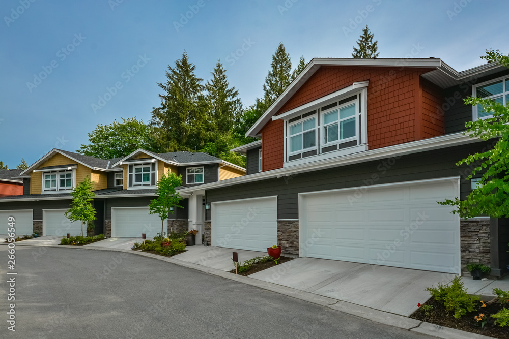 Street of brand new residential triplex houses ready for moving in. Family house for sale Street of brand new residential triplex houses ready for moving in. Family house for sale