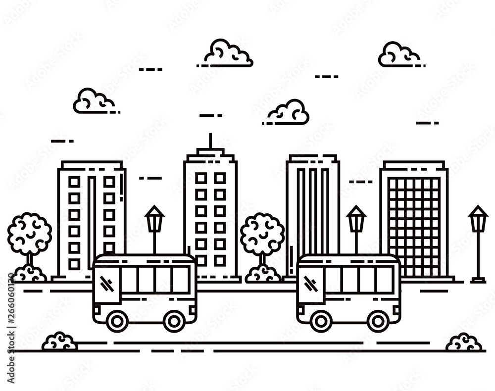 buses in the city street with buildings and trees