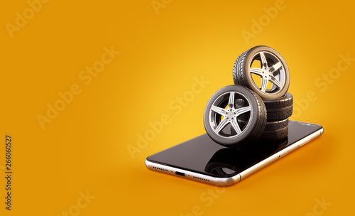 Unusual 3d illustration of car tires on a smartphone screen. Tire Size Calculator. Choosing and buying tires online concept. photo